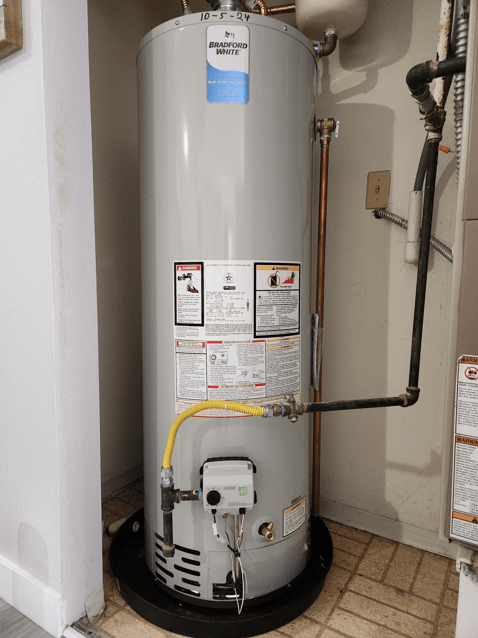 A clean, professionally installed Bradford White water heater by a Luke's technician in a Houston home